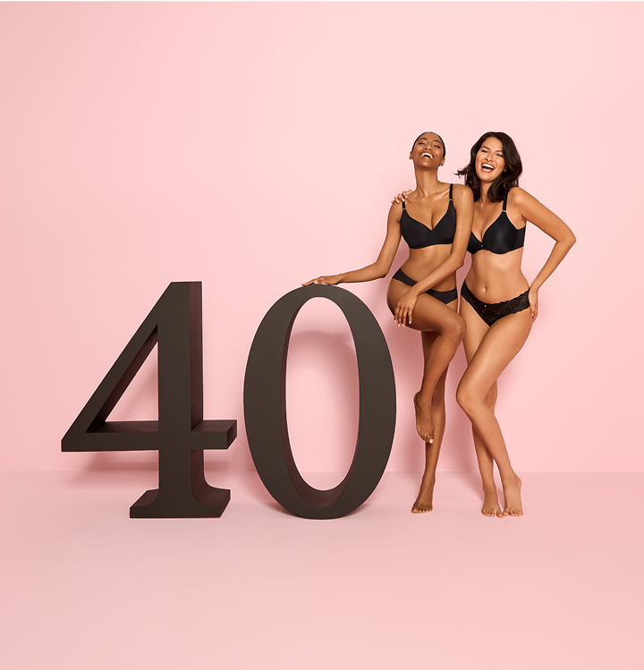 Model wearing the new Sleek Back bra in black	