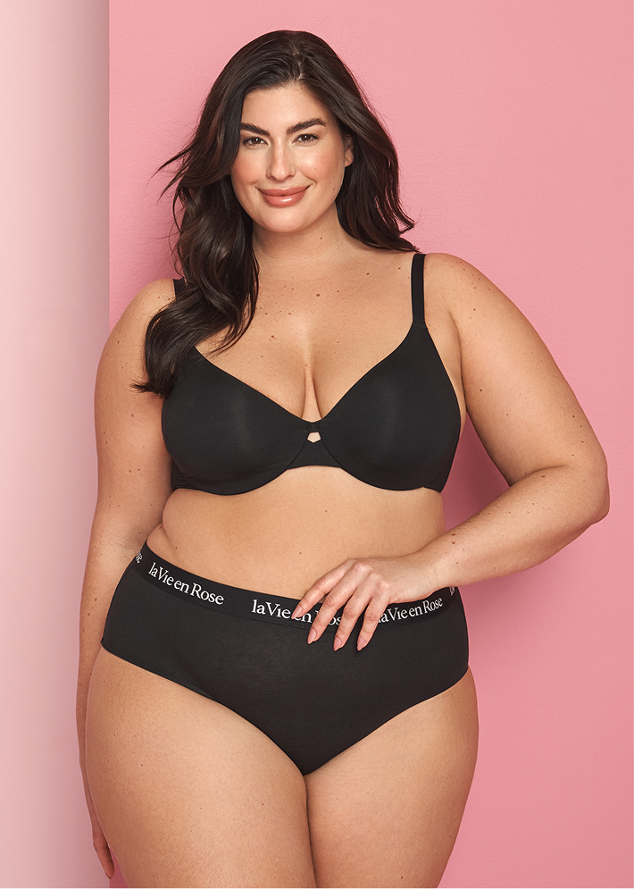 Plus-size model wearing a black bra and panty