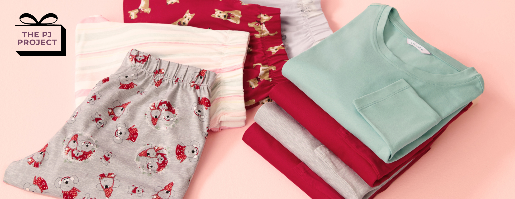 Several pajamas in various colors, folded on a pink background