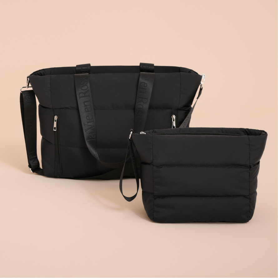 Black quilted travel tote bag and cosmetic bag with matching zip pouch, both featuring La Vie en Rose logo straps.