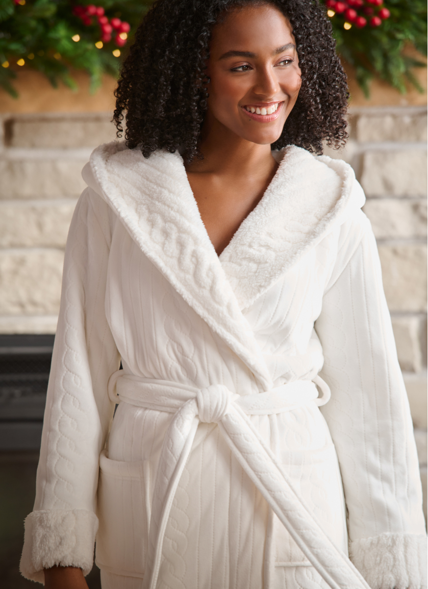 Model wearing a white plush robe.