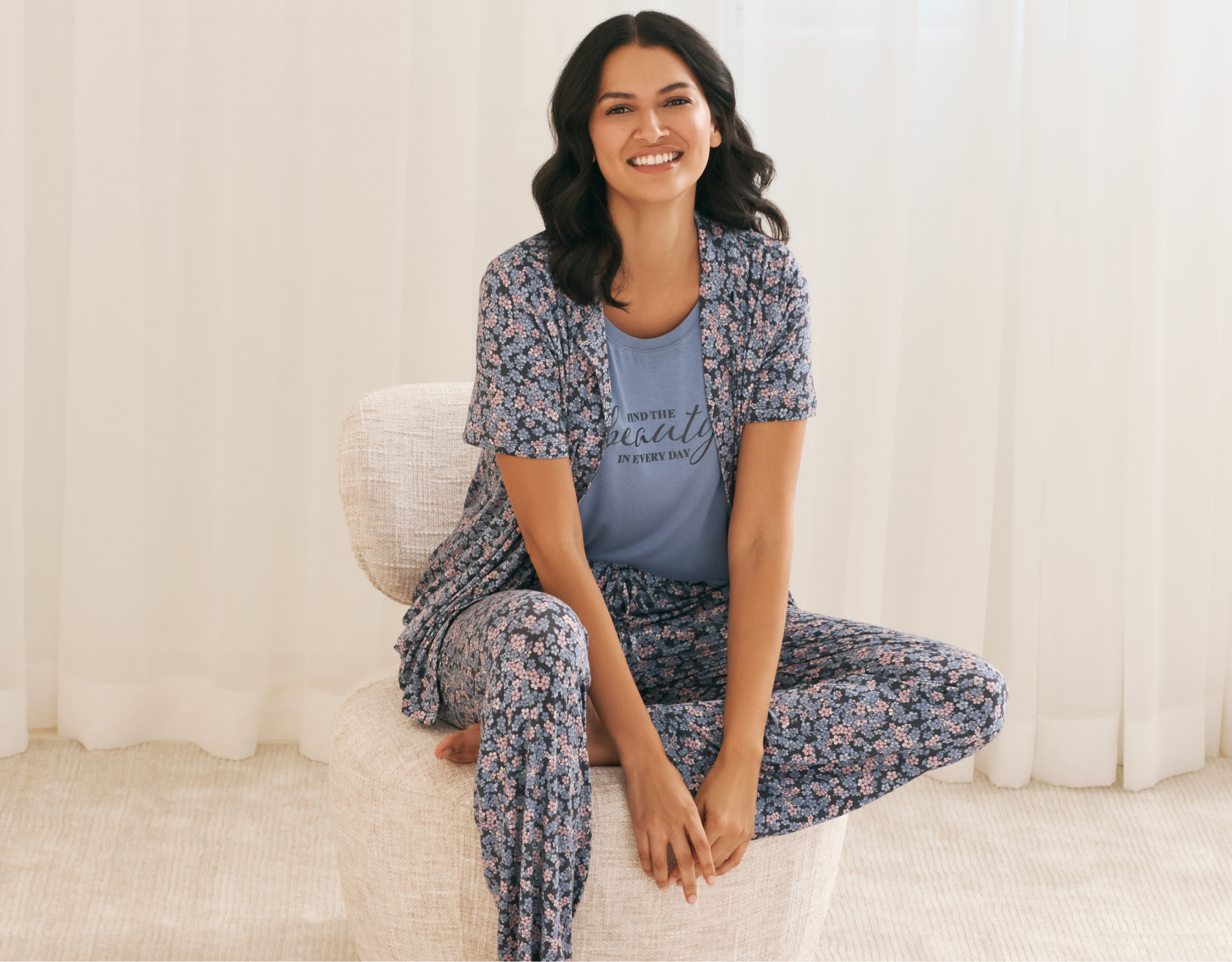 Model in cherry-print pyjamas: short-sleeve top, shorts and pale pink socks.