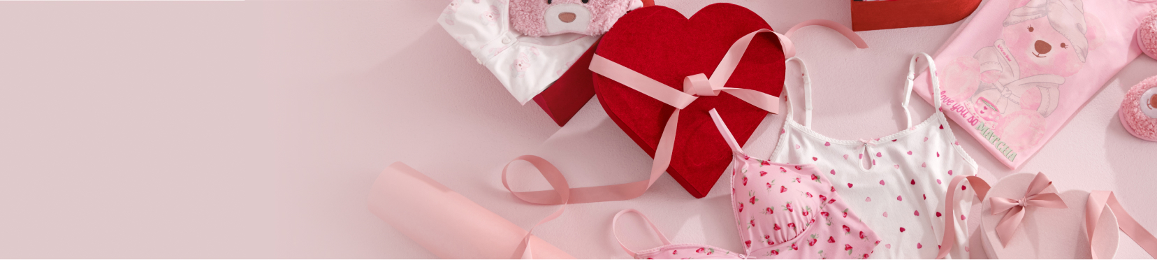 Gift accessories including blankets, slippers and robes neatly wrapped.