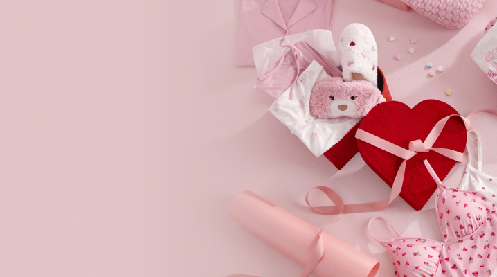 Gift accessories including blankets, slippers and robes neatly wrapped.