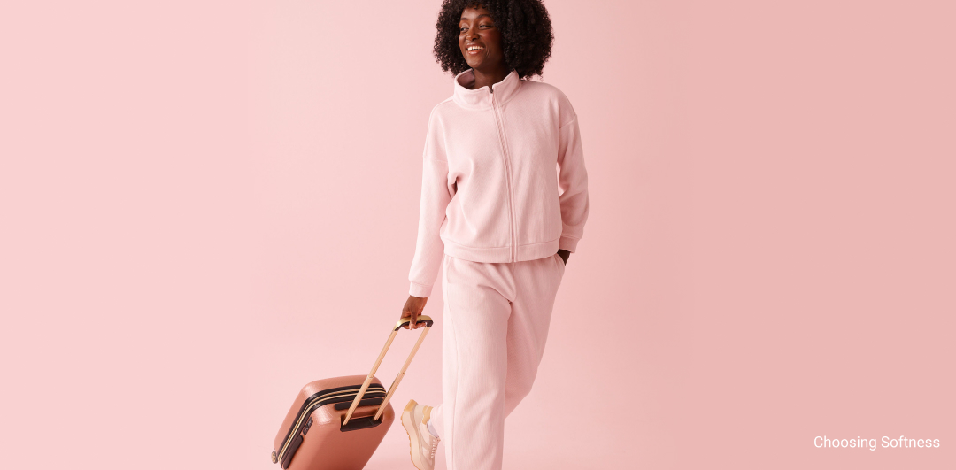 Model wearing a brown short-sleeve loungewear set with wide-leg pants.