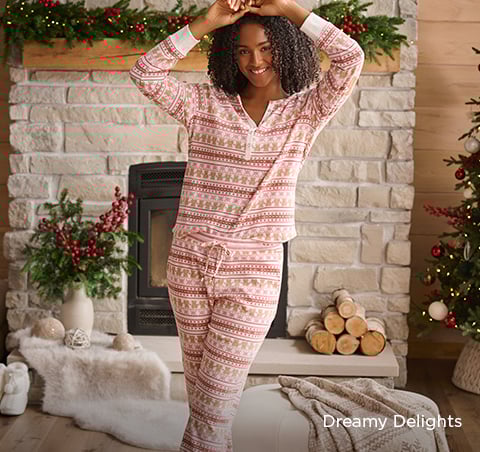 Model wearing a navy lace bra and panty set with a matching velvet robe.