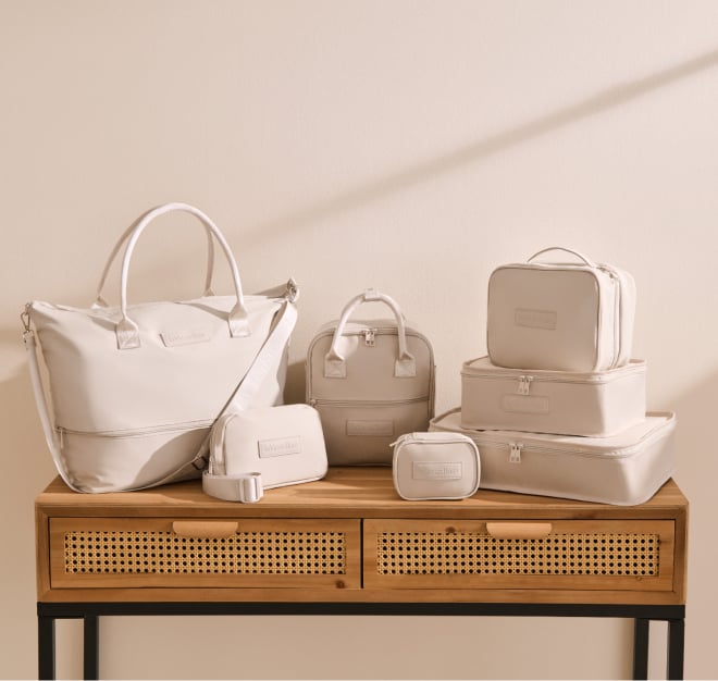 A collection of travel accessories in biege.