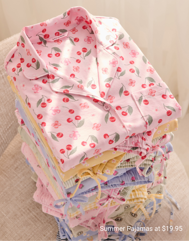 Model wearing a light pink leopard-print kimono over a matching nightdress.