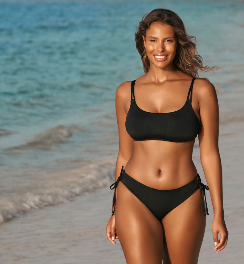 Model wearing 2 piece black swim suite